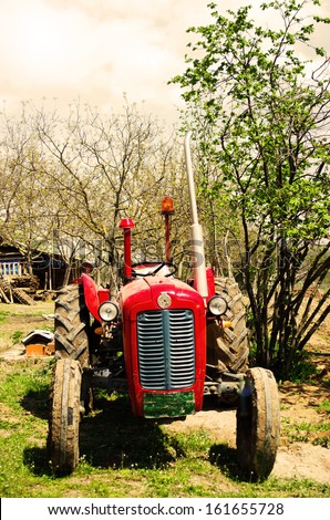 Rusty vintage tractor in countryside