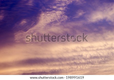 Amazing nature background: dramatic and moody pink, purple and blue cloudy sunset sky