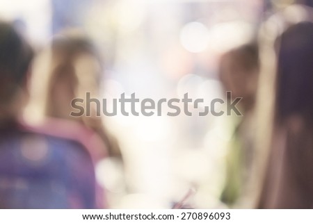 blurred group of people in cafe shop, young friends hanging out, blurred unrecognizable faces