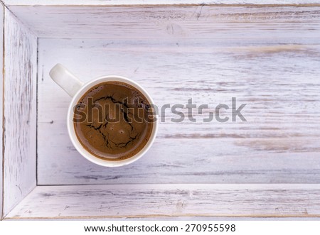 cup of coffee on white wooden salver, Coffee cup top view on wooden table background