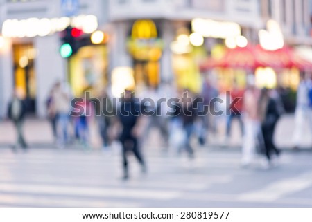 blur abstract people background, unrecognizable silhouettes of people walking on a street