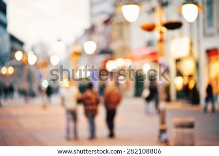 abstract blurred background of people walking in city center