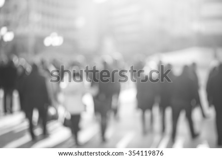blur abstract people background, unrecognizable silhouettes of people walking on a street