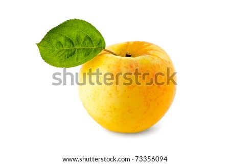 Ripe yellow apple with green leaf isolated on white background