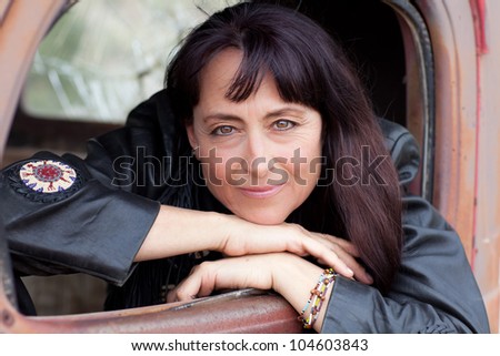 Beautiful Woman in a Vintage truck smiling confidently