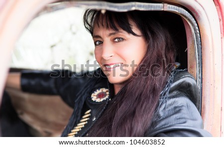 Beautiful Woman in a Vintage truck smiling confidently