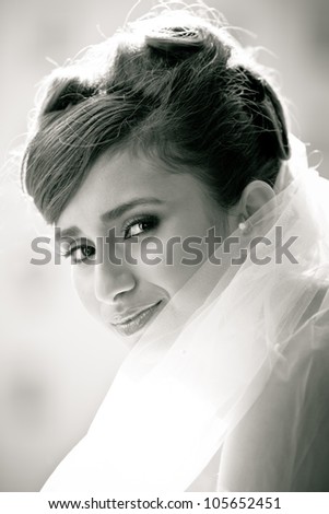 Black and white portrait of a Beautiful Bride Close up glowing from the sun light