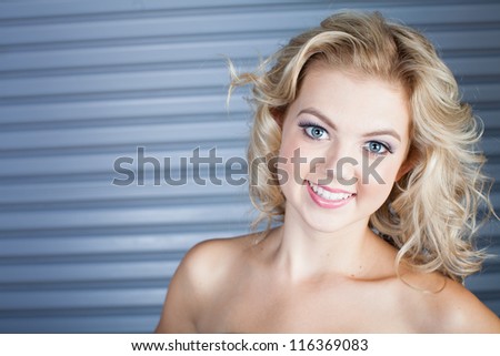 Gorgeous blue eyed Smiling woman with copy space