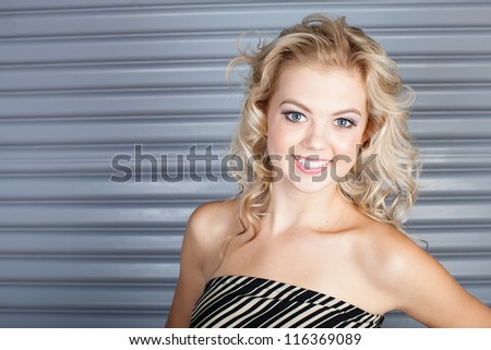 Gorgeous blue eyed Smiling woman with copy space