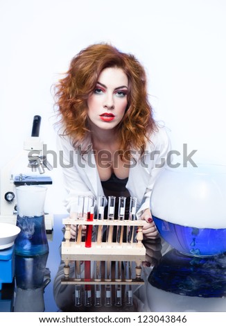 Beautiful Sexy woman Scientist with a test beaker of Love Potion fresh for Valentine's Day