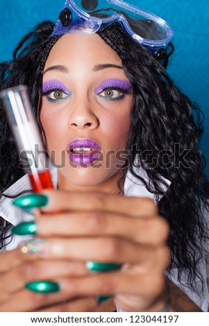Beautiful Sexy woman Scientist with a test beaker of Love Potion fresh for Valentine\'s Day