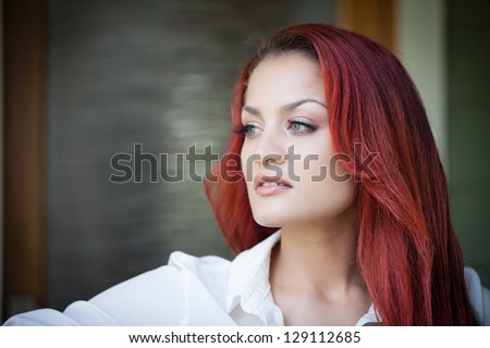 Beautiful Latin woman looking off to the side profile view