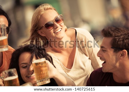 Attractive Young Woman Drinking A Beer On A Beautiful Sunny Day