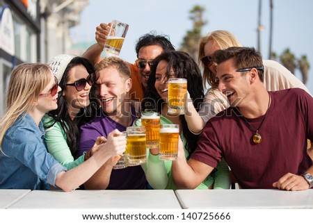 Young People In Their Twenties On The Venice Beach Boardwalk In California Drinking Beer