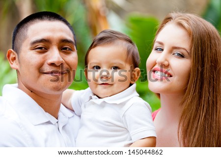 Happy young Family on Babies first Birthday