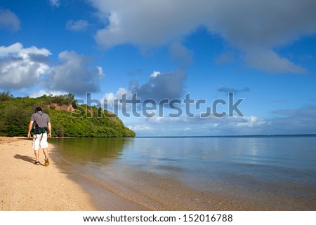 Attractive man in his fifties Hiking Kauai Beach