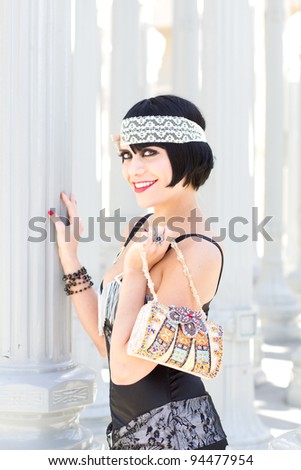 Exotic Woman holding a Purse wearing a headband