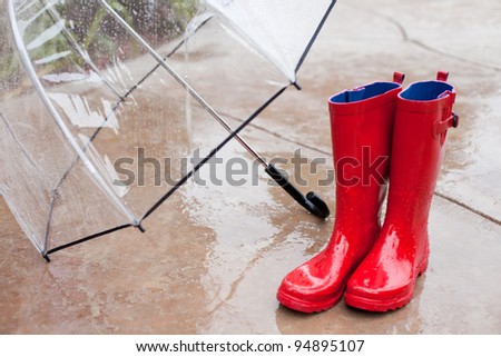 Umbrella and Rain boots on a Rainy day
