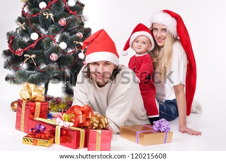 festive family waiting for christmas. studio shot over white background