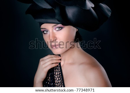 dark portrait of a girl in a dark roses suit