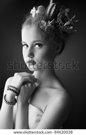 black and white portrait of a Woman with cactus in her hair on a black background