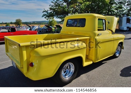 FREDERICK, MD- SEPTEMBER 16: Yellow Vintage Ford Truck on Sept. 16, 2012 in Frederick , MD USA. Alzheimer\'s Association Benefit Car Show at Motor Vehicle Administration in Maryland.