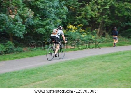 Man Biking at Lake Artimisia Bike Trail, Maryland USA