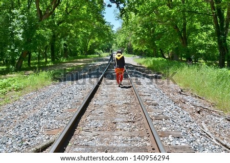 People Walking at Train Tracks at Harpers Ferry in West Virginia USA