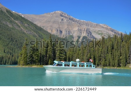 JASPER, ALBERTA - AUGUST 1 - Boat Tours at Maligne Lake in Jasper, Canada on August 01, 2014. Maligne Lake is visited by millions of people every year, and do the boat tour to Spirit Island.