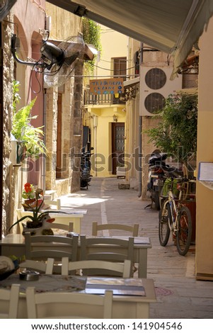 RETHYMNO, GREECE - MAY 27. Tavern in the narrow streets of the old town in Rethymno on May 27, 2013. Because of his picturesque old town is Rethymno of one of the mostly visited cities on Crete