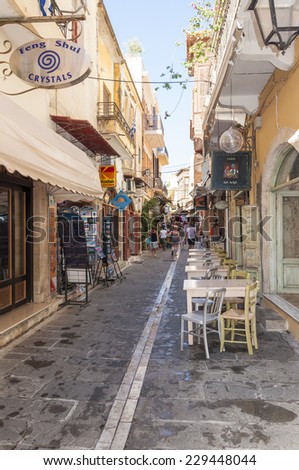 RETHYMNO, GREECE - SEPTEMBER 13. Tourists in Taverns and Gift Shops in the narrow streets of the old town in Rethymno on September 13, 2014. Rethymno is nice city with a old venetian harbor on Crete
