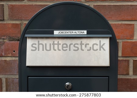 HAMBURG, GERMANY - MAY 03. Mail delivery for the employment office after business hours in Hamburg on May 03, 2015. Lettering at letter box on the wall of the Job Center Hamburg Altona