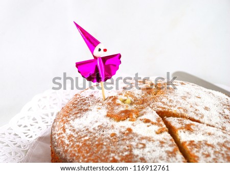 Great cake with powdered sugar, with ornament. Cut a ration