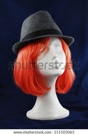 Model of polystyrene pink wig grey hat lit study