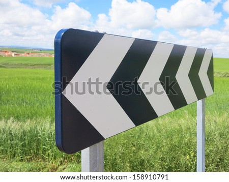 Traffic signal, black and white arrow