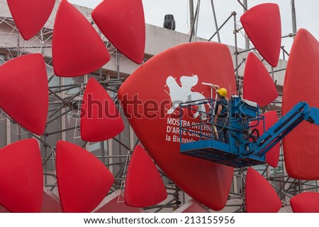 25 August 2014  - -gluing stickers on the decoration of the cinema theater on the 71 film festival in Venice