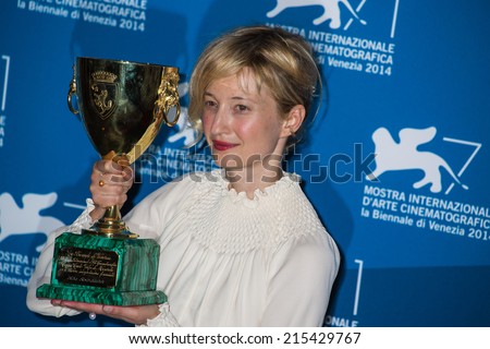 VENICE, ITALY - SEPTEMBER 06:Italian actress Alba Rohrwacher holds the Volpi Cup for Best Actress-photocall following the awards ceremony on the closing day of the 71st Venice Film Festival on September 6, 2014 at Venice Lido.