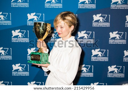 VENICE, ITALY - SEPTEMBER 06: Italian actress Alba Rohrwacher holds the Volpi Cup for Best Actres- photocall following the awards ceremony on the closing day of the 71st Venice Film Festival on September 6, 2014 at Venice Lido.