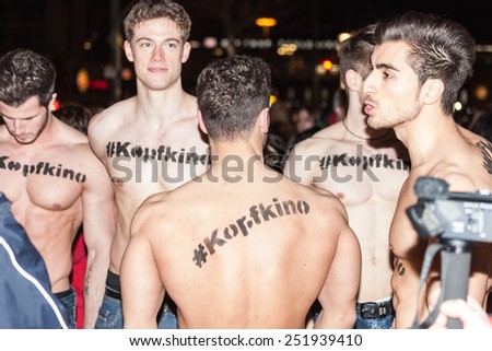 BERLIN, GERMANY - FEBRUARY 11: top less guys making promotion ad at the \'Fifty Shades of Grey\' premiere during the 65th Berlinale International Film Festival at Zoo Palast on February 11, 2015