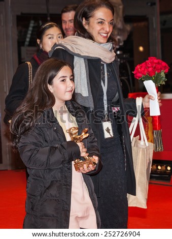 BERLIN, GERMANY - FEBRUARY 14, 2015: Solmaz Panahi with the golden bear for \'Taxi\' during the Closing Ceremony of the 65th Berlinale International Film Festival at Berlinale Palace