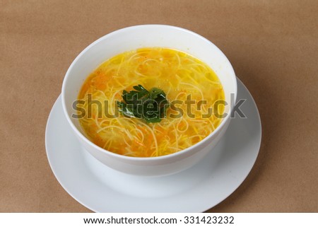 chicken soup with noodles, carrots and parsley - homemade food - my grandmother's cooking