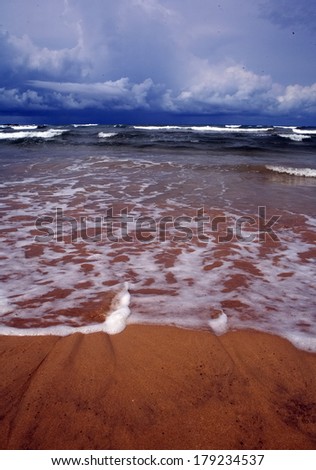 Beautiful background of  tropic ocean beach and  textured with white bubbles wave line from on yellow tropic ocean beach