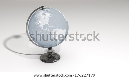 A crystal globe on a chrome pedestal over white featuring the western hemisphere. Some elements of this image furnished by NASA.