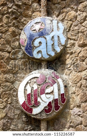 BARCELONA, SPAIN - APRIL 17:Original sign of Park Guell on the wall of one the entrance building of the park, designed from architect Antonio Gaudi in Barcelona, Spain on April 17, 2010.