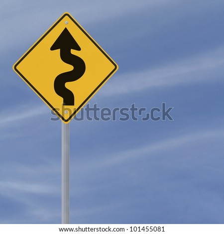 Winding road ahead sign on a blue sky background with copy space