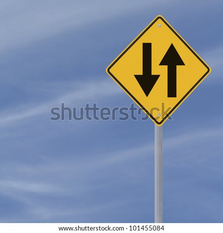 Two way road sign on a blue sky background with copy space