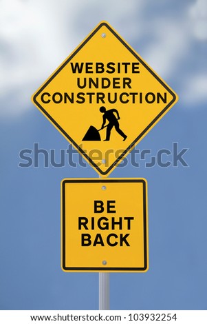 A road sign indicating an internet website under construction