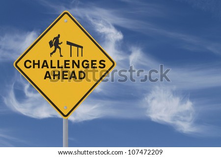 Road sign showing the silhouette of a businessman about to jump over a hurdle (against a sky background with copy space)