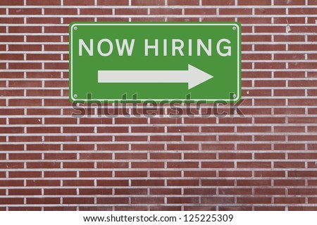 A job opportunity sign on a red brick wall