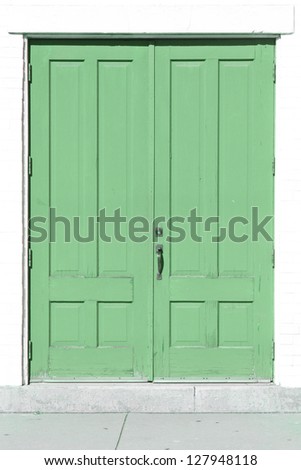 An old and weathered green door